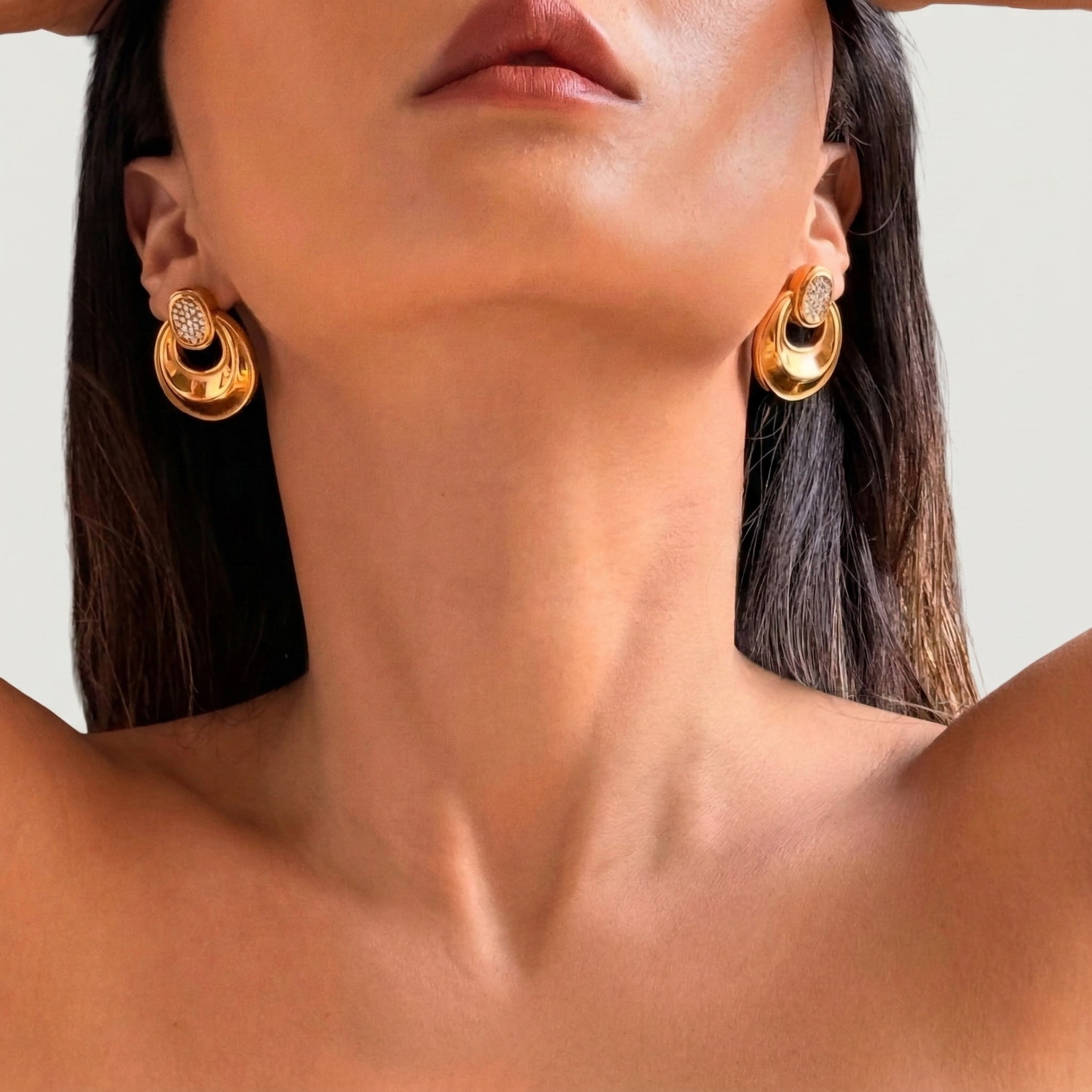 Model wearing vintage style 18K gold plated hoop earrings with zircon stones