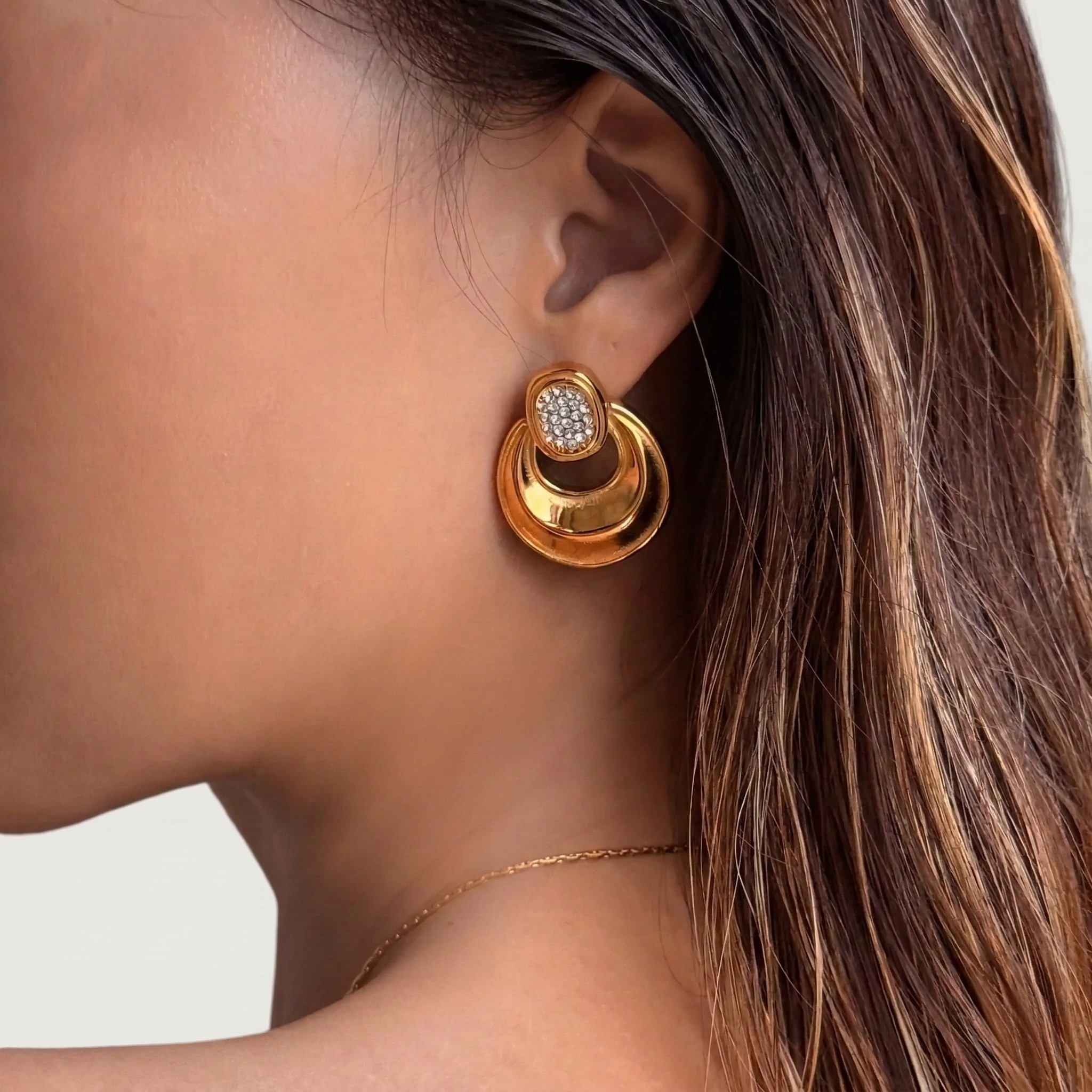 Close-up of woman wearing vintage style 18K gold plated hoop earrings with zircon stones